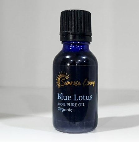 Blue bottle of Blue Lotus essential oil with black cap on a white background