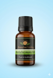 Bottle of Sunrise Living Helichrysum Oil on a light blue background