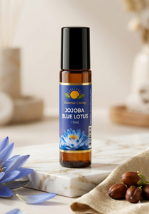 Jojoba Blue Lotus essential oil Roll on bottle with a blue flower label on a marble surface.