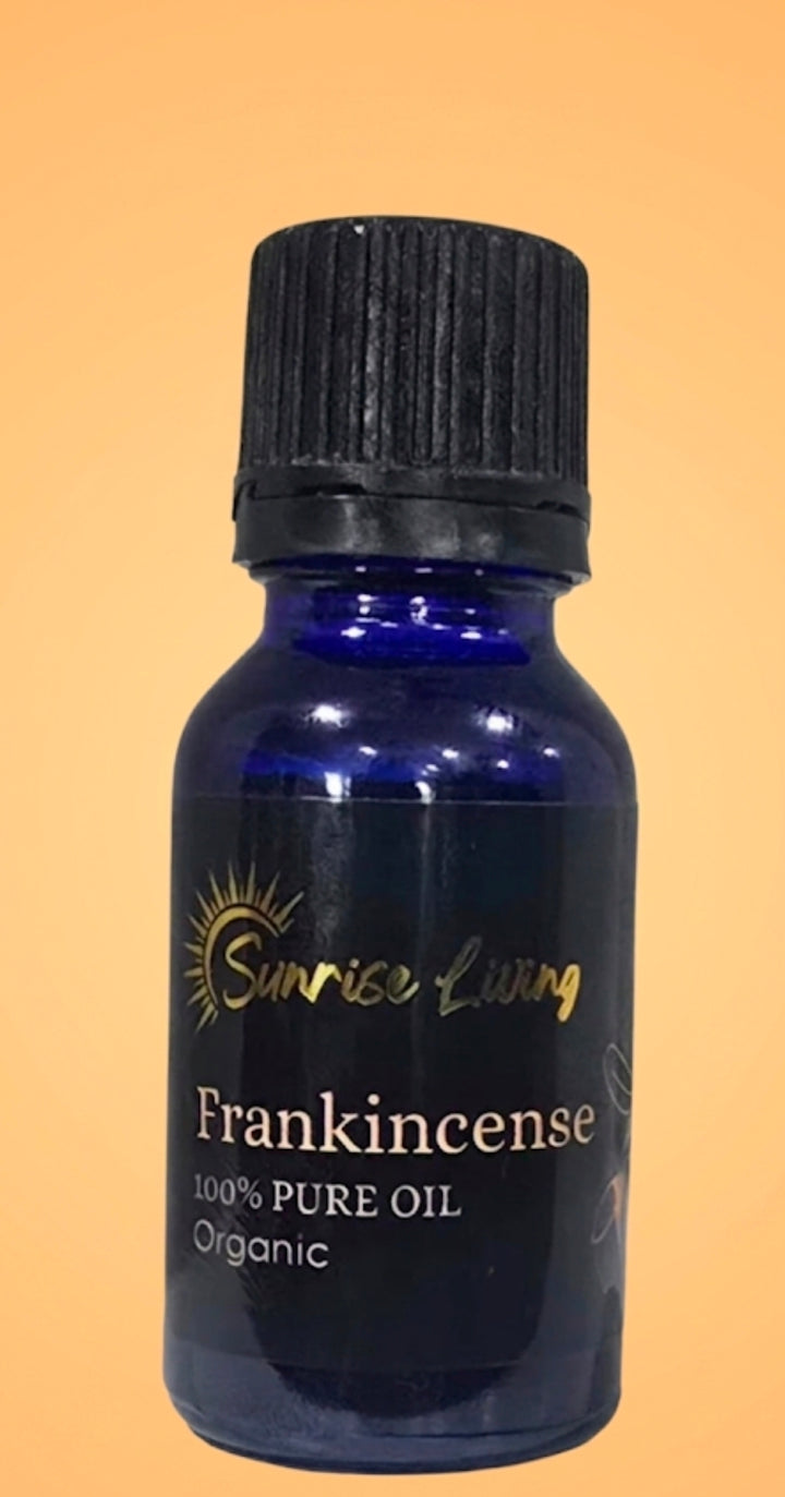 Bottle of Sunrise Living Frankincense oil on a beige background